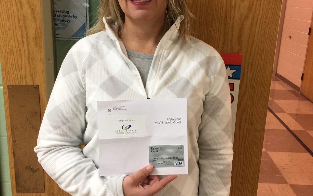 Amy Fiedler receives her gift card for completing the Great Plains Customer Survey.