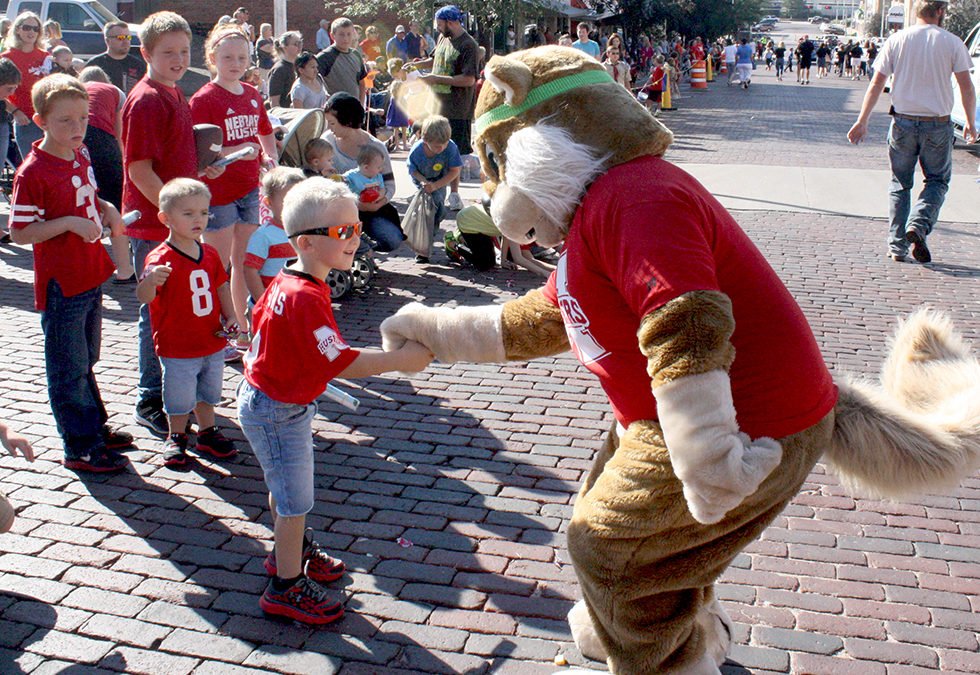 Chatty the Squirrel shaking little boy's hand