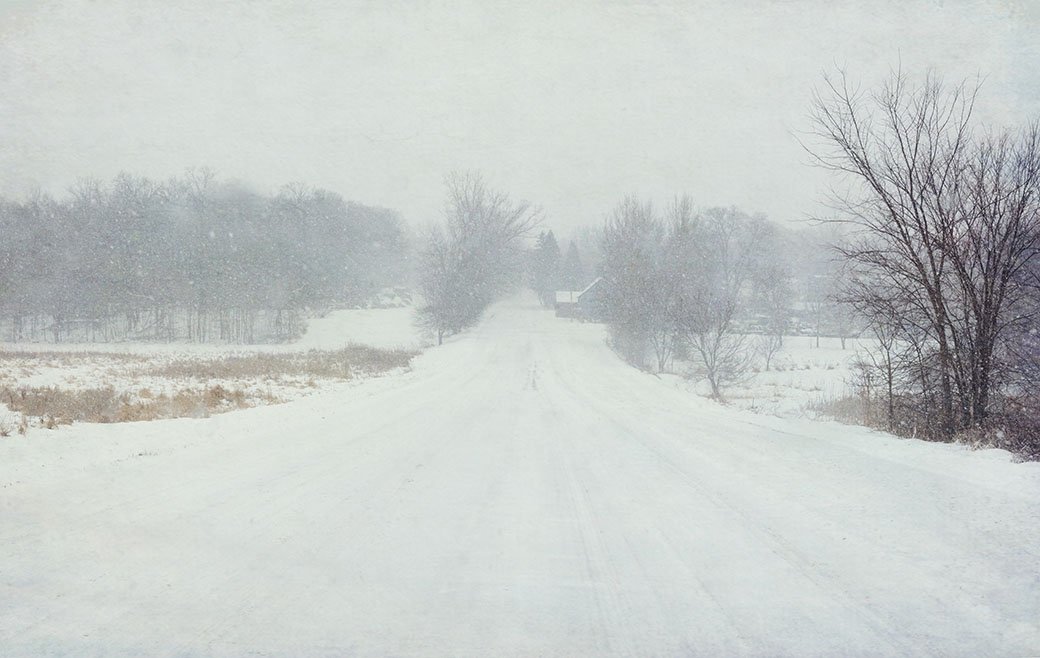 Country road during snow storm