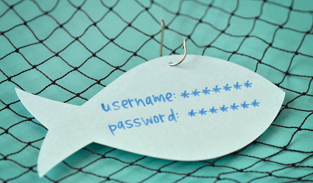 Username and password written on a paper note in the shape of a fish attached to a hook
