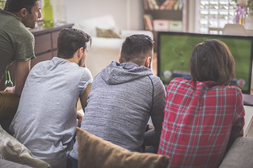 4 men watching sports