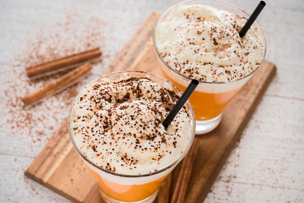 Autumn pumpkin spice latte with milk and cream