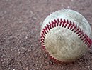 dirty baseball on ground