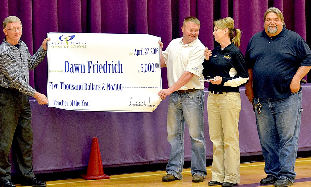 outstanding teacher award winner being presented with her check large