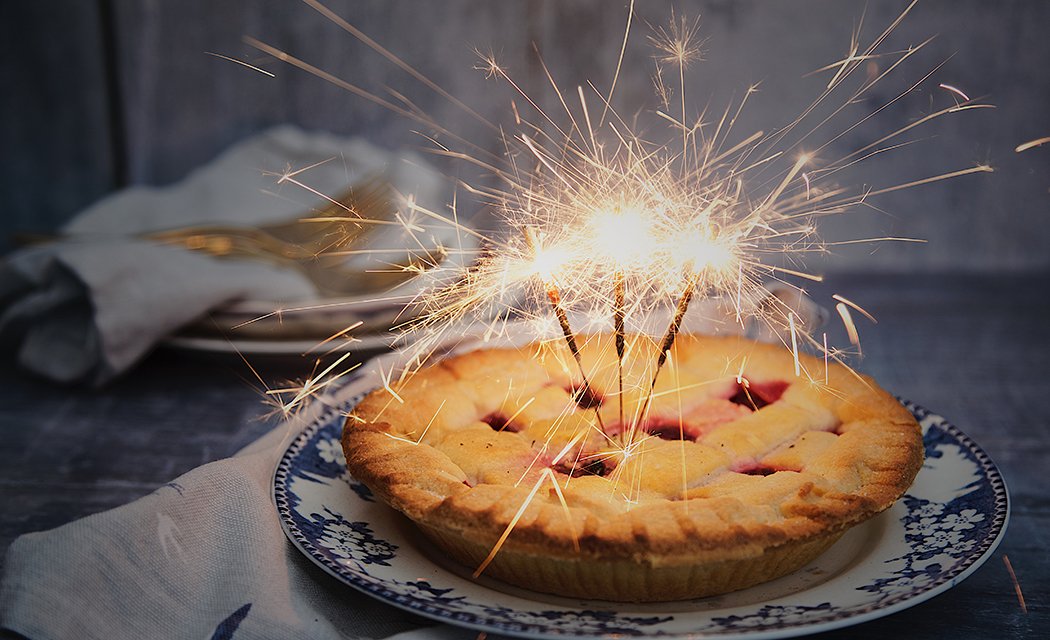 pie on a plate with fireworks in it