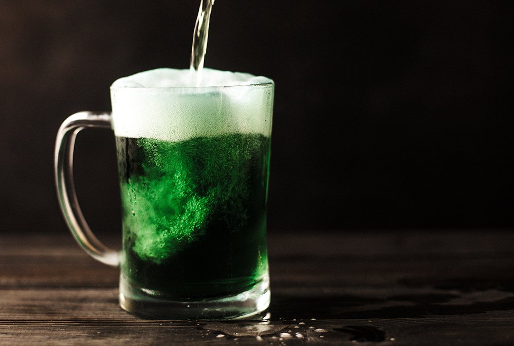 mug of green drink with foam