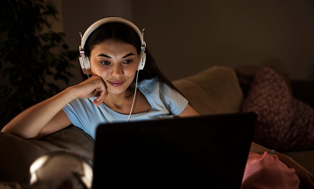 Girl streaming in headphones